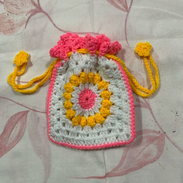 pink and white designer potli